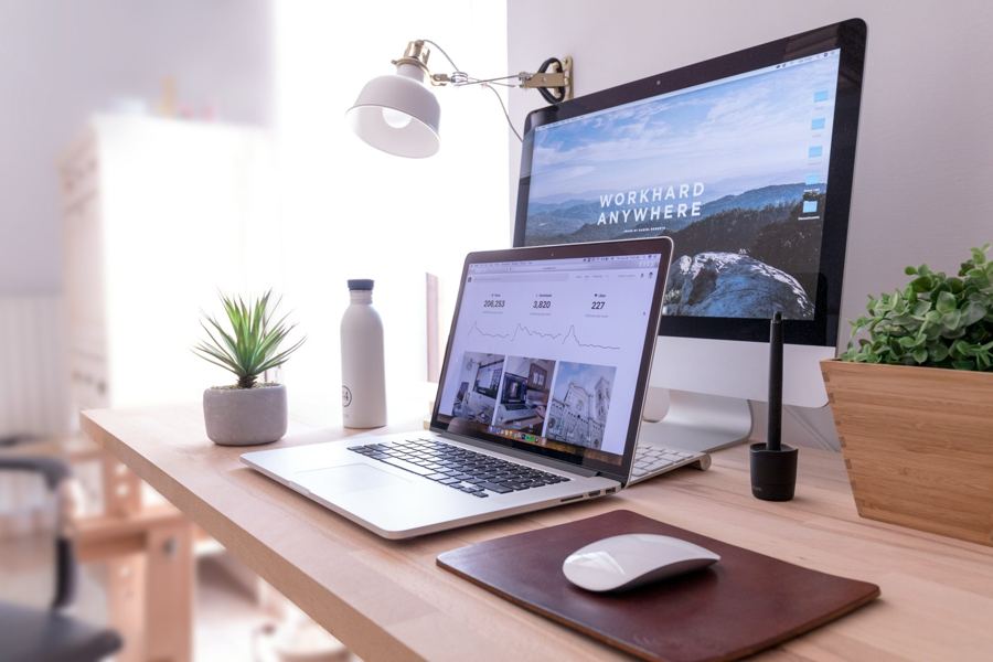 Laptop and desktop computer on a desk